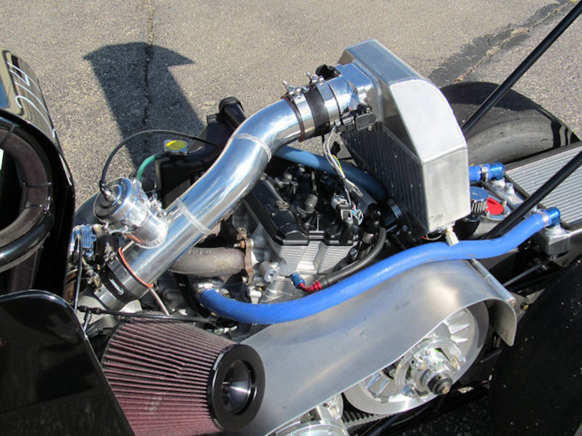 Essentially half of a Suzuki Hayabusa engine, the Arctic Cat powerplant has four-valve cylinder heads,