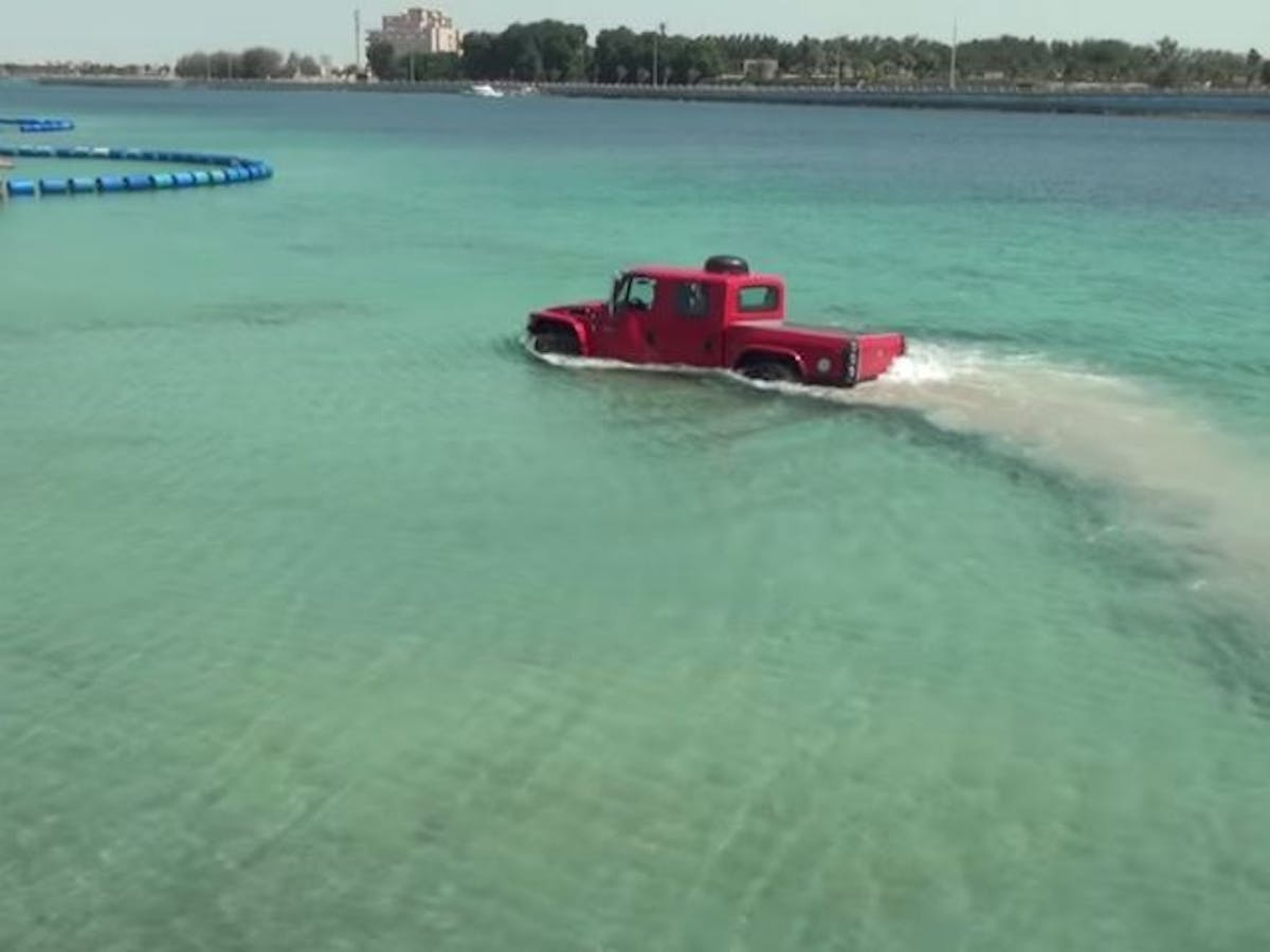 Kutbi fords ahead in the beautiful Arabian water near Jellah City, Saudi Arabia.