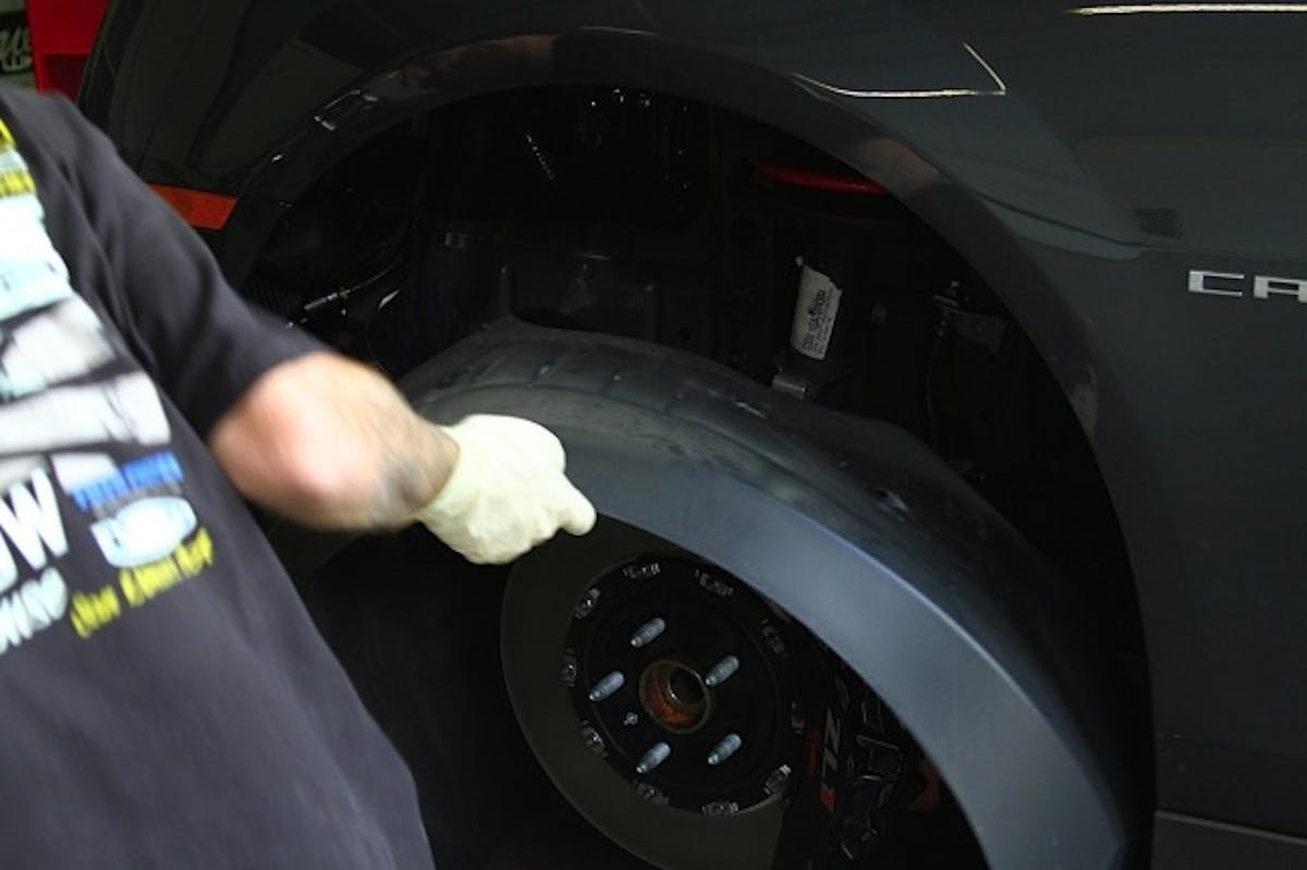 With the wheels and tires removed, what's next is removing the fender wells, which give us access to internal fasteners and wiring.