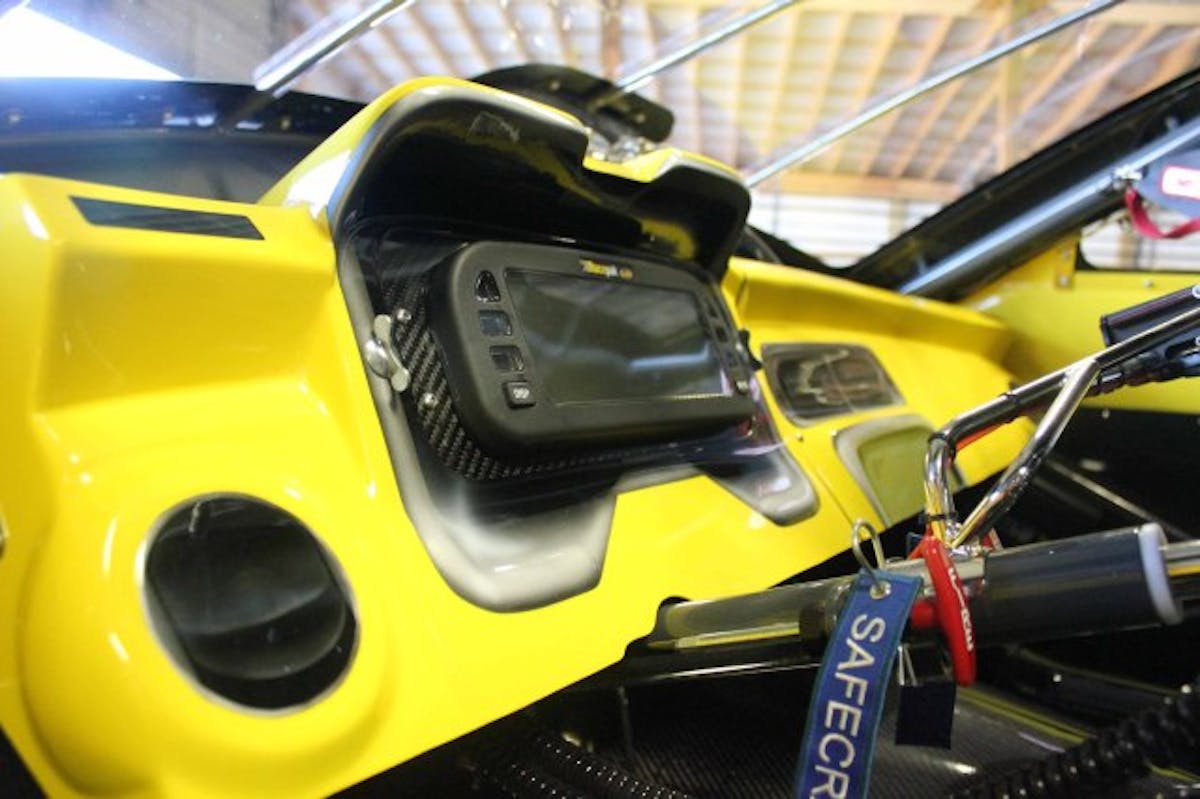 Inside The Cockpit: One of my favorite creations on this car is the custom dash board that is modeled after a GM-factory style 2014 Camaro dash panel, even with the cutouts for the stock tachometer and speedometer, which have been filled by a Racepak UDX digital dash readout.