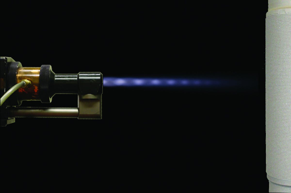 The moly coating is applied to this stack of piston rings through the use of a jet-fuel-powered supersonic gun, which impregnates the cermet material into the face of the ring.