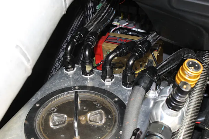 The water returns back to our holding tank to be recirculated during the run, and we hook it up to our Concato Racing chiller between passes to cool the engine down.