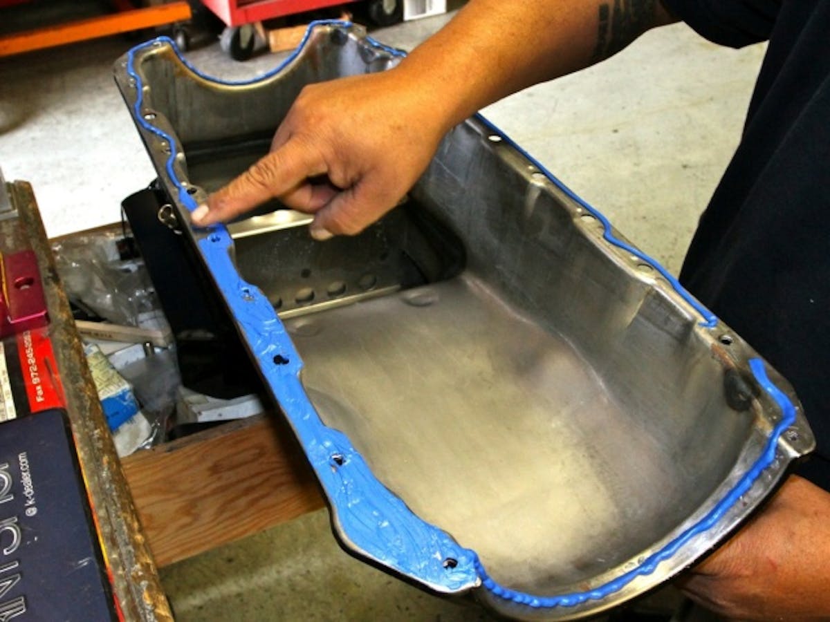 Oil pan installation is a simple task, but it requires some finesse to get correct.