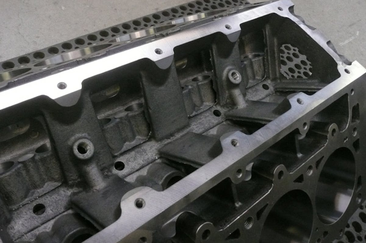 Here we see the lifter valley and the inner row head fastener provisions. The NPT openings are part of the priority main oiling system,. The 1/4" NPT openings allow access to smaller 1/8 NPT threads that are used for lifter oil gallery restricting.