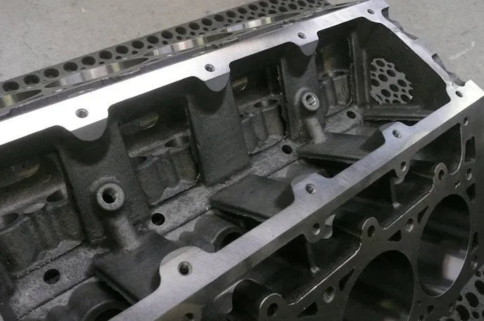 Here we see the lifter valley and the inner row head fastener provisions. The NPT openings are part of the priority main oiling system,. The 1/4" NPT openings allow access to smaller 1/8 NPT threads that are used for lifter oil gallery restricting.