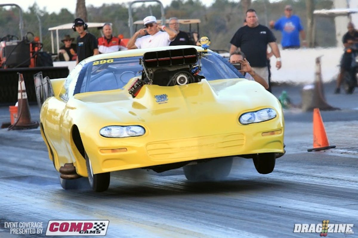 Local Racer Ken Cruz looked like he got up on the wheelie bars to hard unloading the tires and going into near immediate wheel-spin.