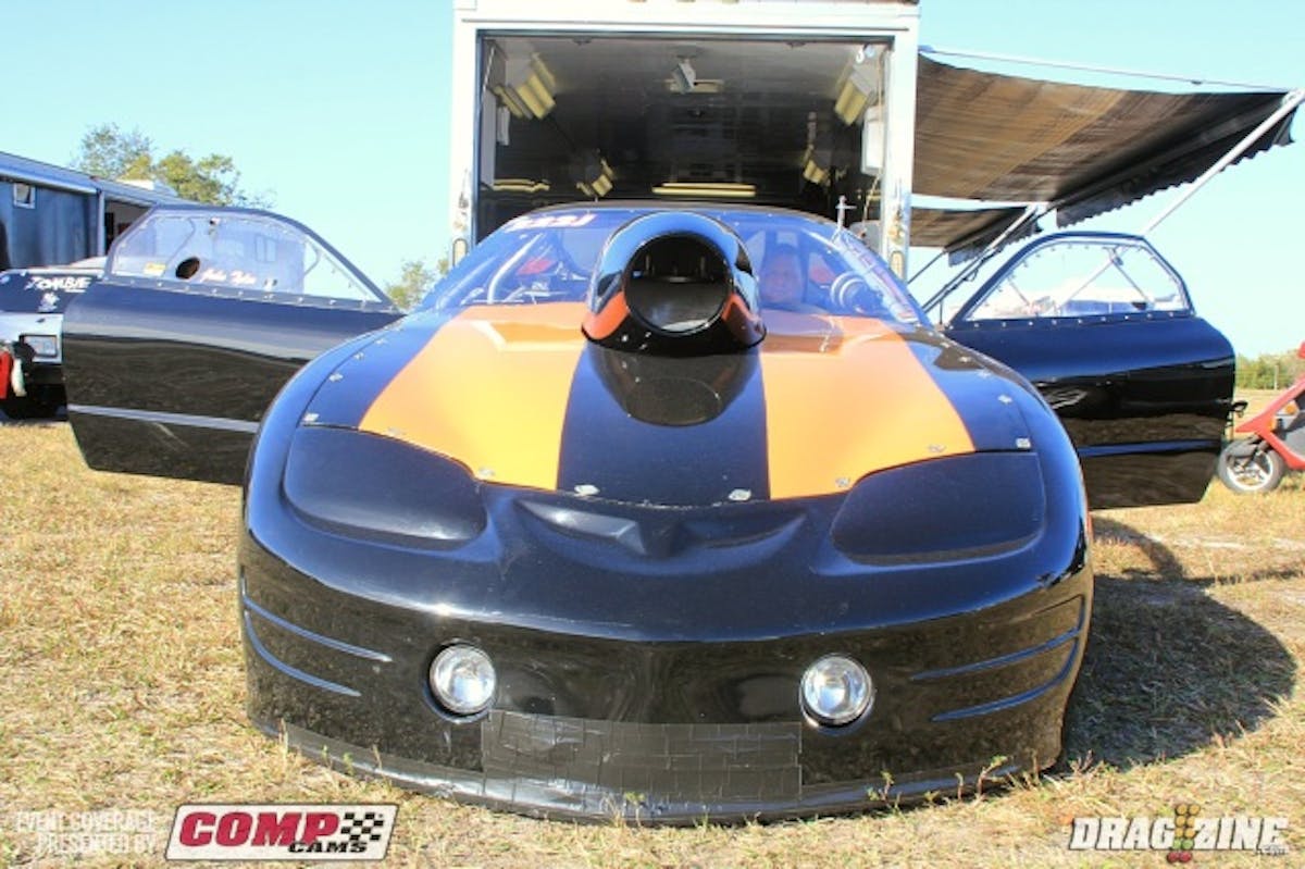 As we mentioned yesterday Matt Gilmore damaged his Open Outlaw car hitting the wall at the last event. The team thrashed to make the repairs just wrapping up on Thursday night. Matt Gilmore, Dave Curtis and Alan Stewart did the work on the chassis, basically cutting off the front half and replacing it. Ed Mitchell is the car owner for the Ocala based M&M Racing Firebird running Outlaw 632 this weekend. This is the third time out with the car after purchasing it last year and is driven by John Tyler. The engine is from Sunset Racecraft topped with two systems from Induction Solutions and backed by a Freakshow Performance powerglide.