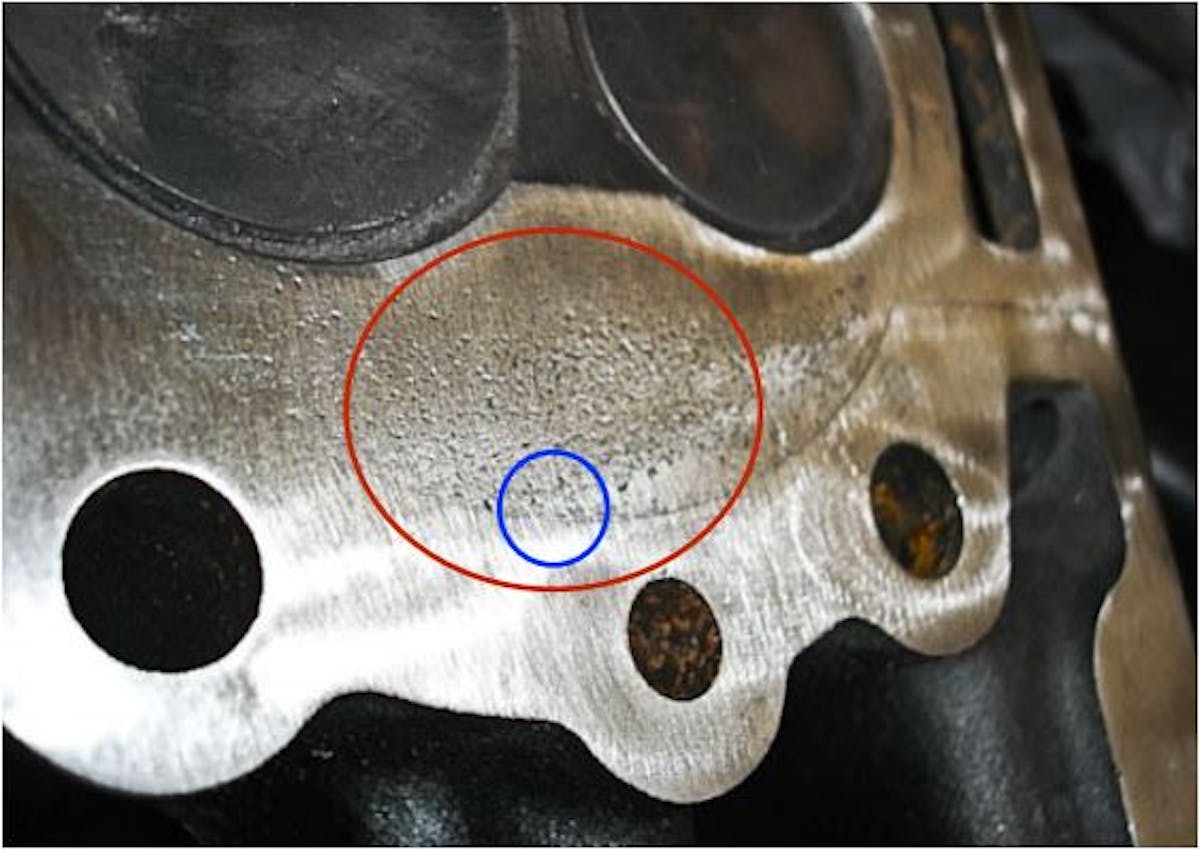 Surface finish is critical. If the block or cylinder head shows signs of pitting, this must be repaired or replaced before an MLS gasket is used. Serious pitting as shown in this image will not seal with an MLS gasket.