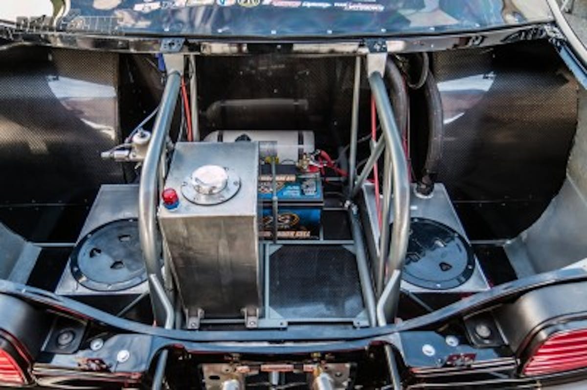 Chris Terry Racing added a spot for the second fuel cell in the trunk along with the extra water tank for the Impala's Dragweek duty.