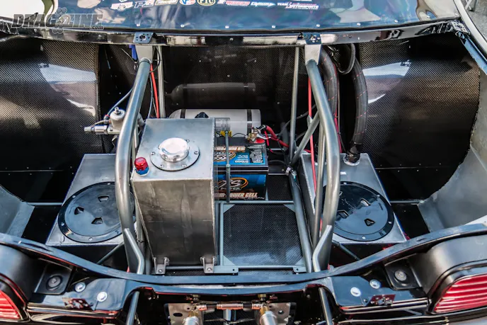 Chris Terry Racing added a spot for the second fuel cell in the trunk along with the extra water tank for the Impala's Dragweek duty.