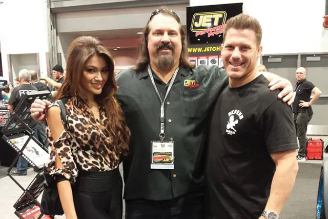 That's Nicholas (center) with LOORS Pro Lite driver Erik Apple at a trade show recently. 