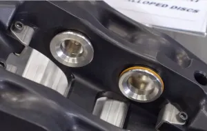 The zero drag system eliminates parasitic friction by retracting the pads by a tiny fraction of an inch to keep them out of contact with the rotors when they aren't in use.