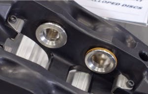 The zero drag system eliminates parasitic friction by retracting the pads by a tiny fraction of an inch to keep them out of contact with the rotors when they aren't in use.