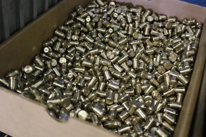 Fuel pump pushrod tips in line to be ground to the proper dimensions.