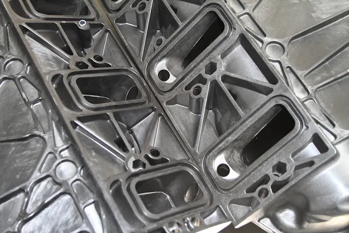 Though these are aftermarket manifolds, they demonstrate the difference between rectangular port (left) and cathedral port designs.