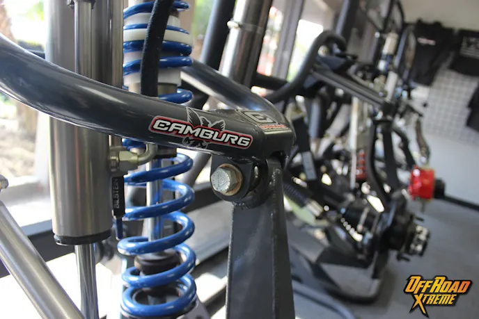 Shown in the lobby, customers can find a whole lineup of Camburg's quality long travel kits.