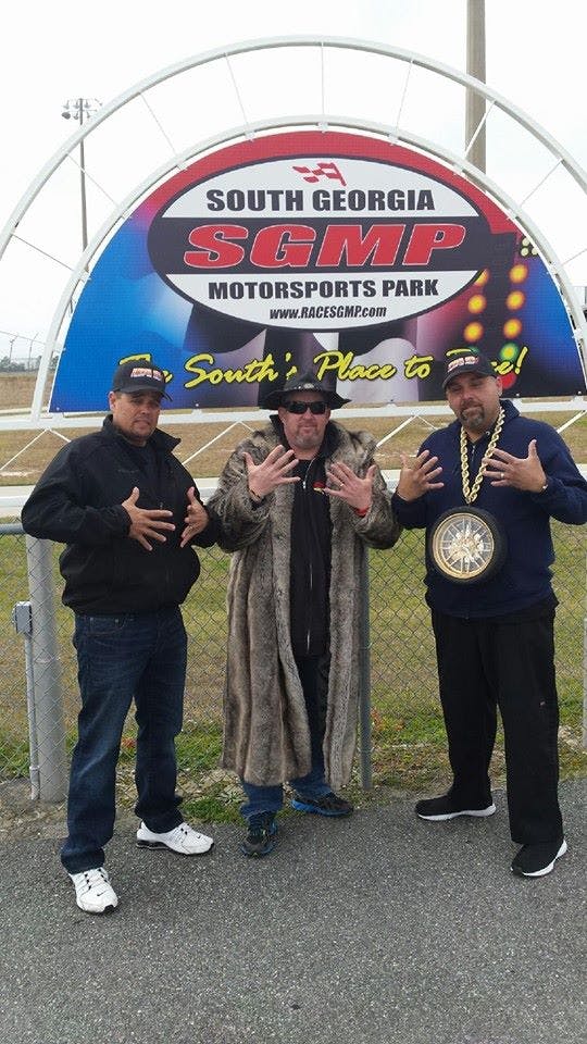 Wade Rich (L) Donald Long (C) and Ozzy Moya celebrate the 5-year contract for Duck X Productions' two-race series at SGMP.
