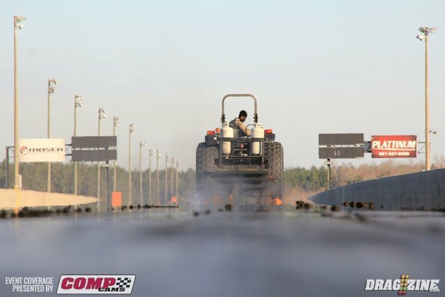 Once again the crew is at it early gettign the track prepared with a fresh surface. It also helps to warm the surface while scraping off the cold rubber.
