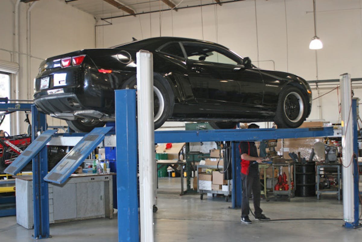 A car up on the rack being spec'd out for Energy Suspension bushings.