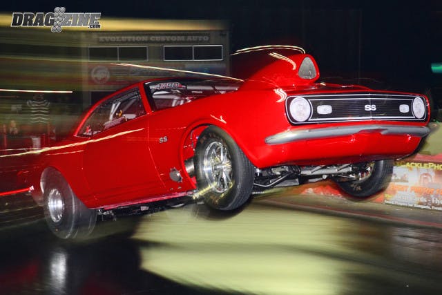 X275 racer Justin Curry took a wild ride in pre-race testing when his Camaro got up on the bumper and turned over onto its side.