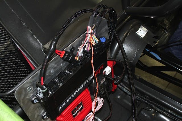 A closer look at the Dominator mounted in our 275 Drag Radial Camaro. One of the big strengths of both the HP and Dominator EFI systems is their ability to easily interface with external electronics, like ignition boxes, traction control, and datalogging systems.