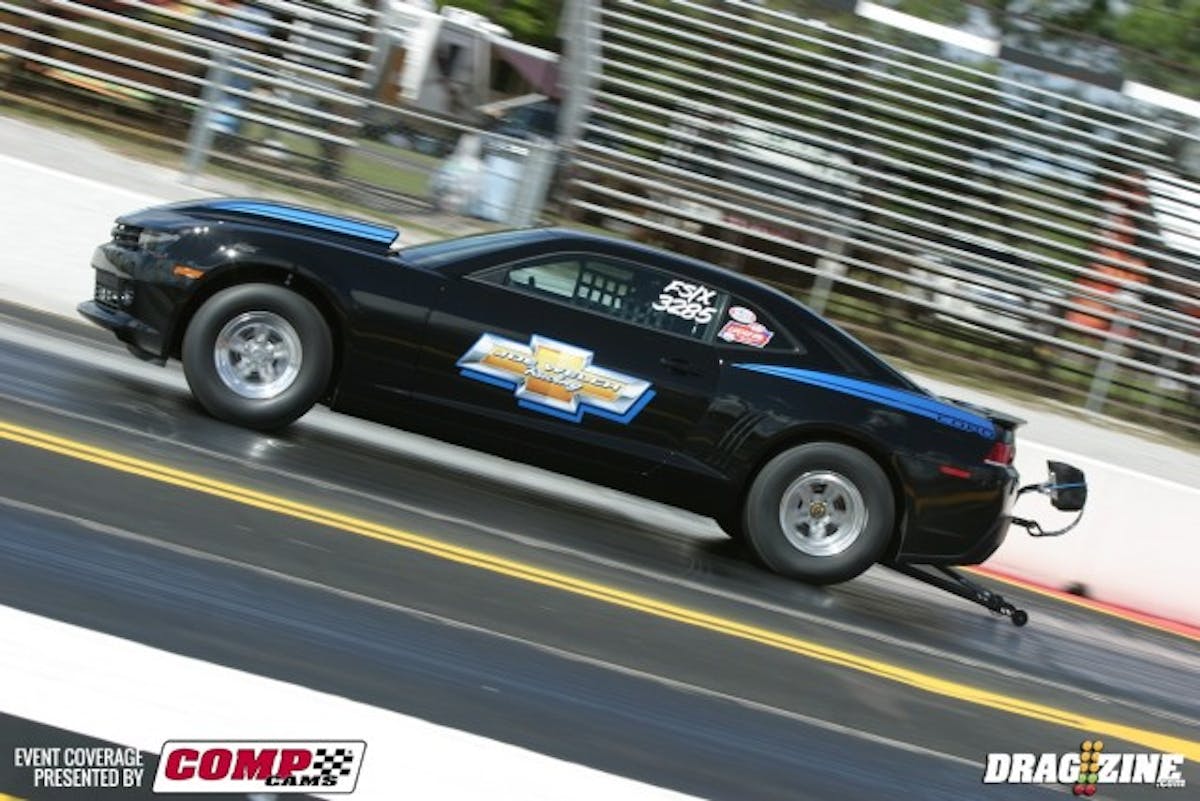 Joe Welch's COPO Camaro is a '14 model, purchased as a roller, and fitted with a naturally aspirated 427 LSX engine featuring NHRA-legal modifications. In Factory Stock, the minimum weight is 3,350, and Welch ran in the 8.90s on Tuesday. 