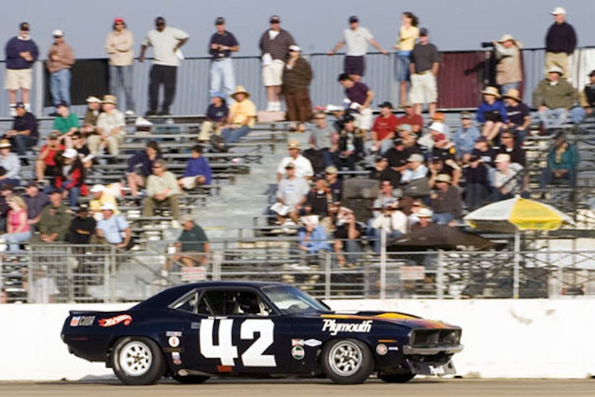 Andy Boone behind the wheel of Dan Gurney's AAR 'Cuda. Image: Historic TransAm