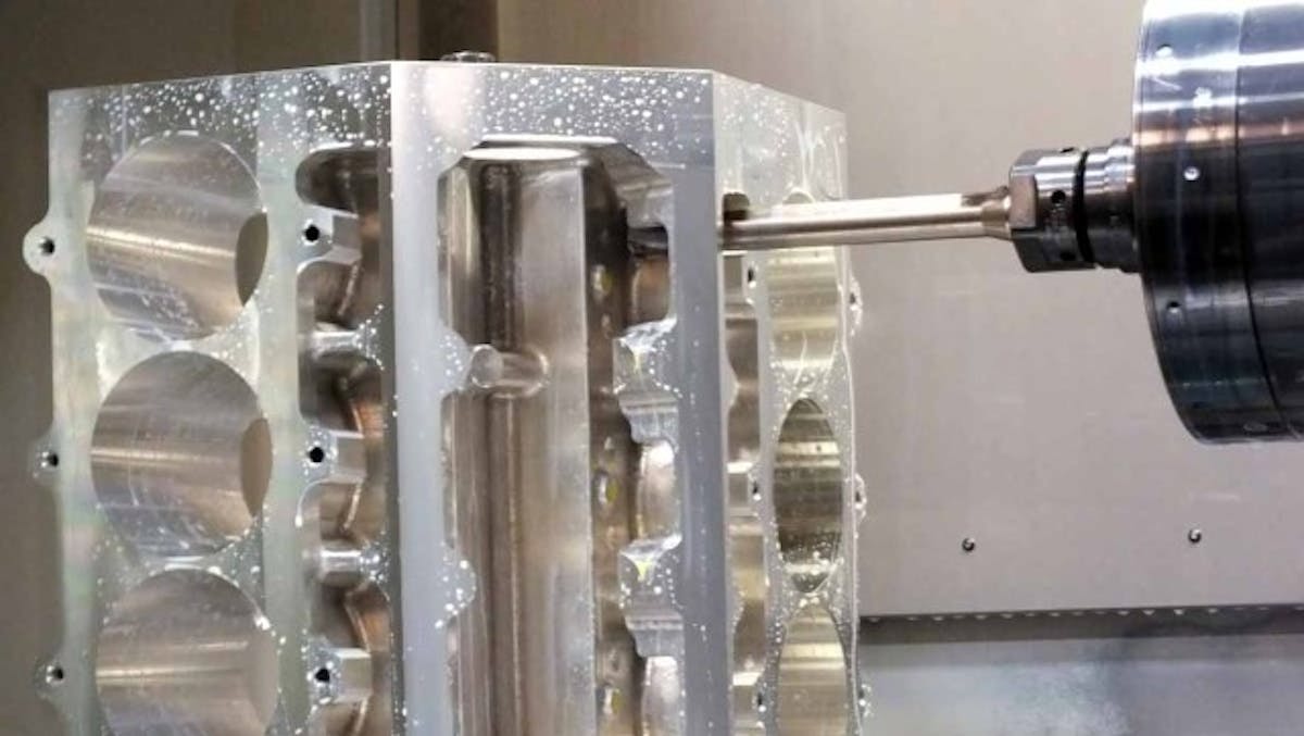 The CNC mill starting work on the lifter bore dimensions. Note the head bolt-hole locations only exist for the outboard fasteners at this time.