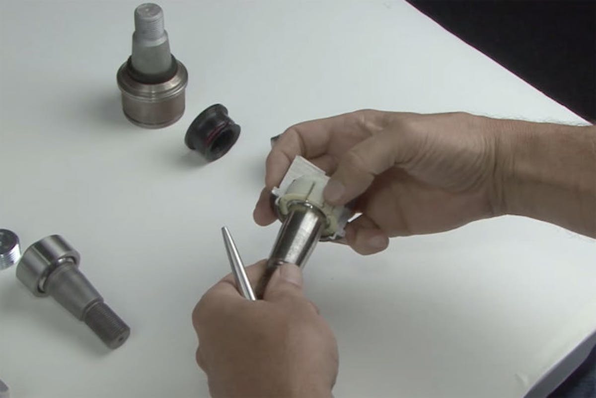 The stock ball joint's plastic socket degrades quickly in off-road usage.