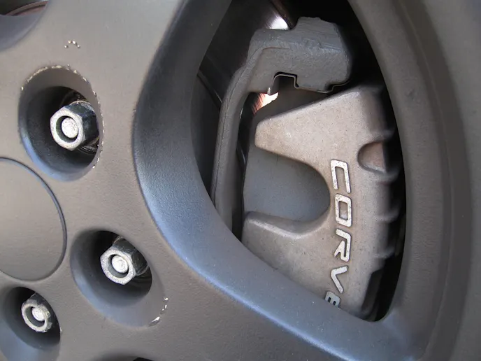 Our Corvette came factory equipped with sliding brake calipers (two piston in front, single piston out back) and vented solid discs.