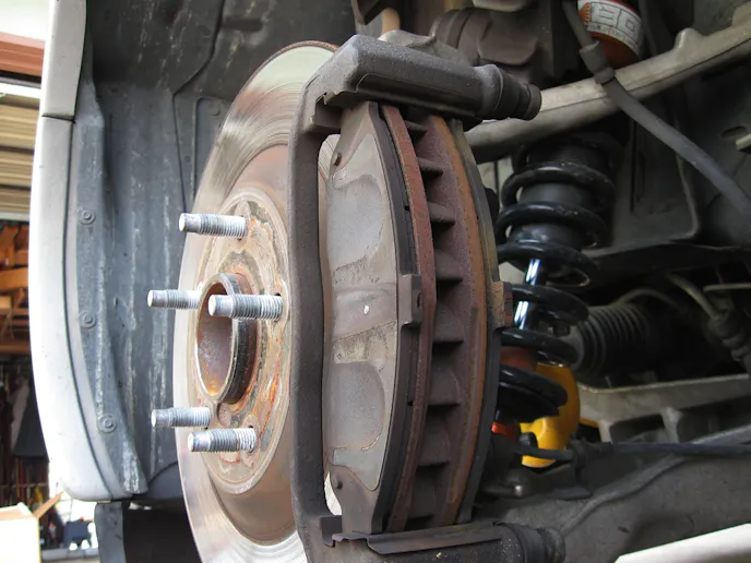 The Corvette's stock brakes, though not as 'racy' as opposed piston caliper aftermarket pieces, still show competition heritage. It's very easy to pull the caliper and swap pads.