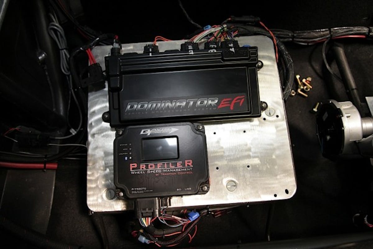 Late last season, we got our hands on the Profiler to put it to the test in our Project BlownZ 275 Drag Radial Camaro. The Profiler works in conjunction with our Holley Dominator EFI system to manage timing during the run. As you can see in the image at above left, the Profiler fits conveniently right on top of the MSD Power Grid in our electronics panel.