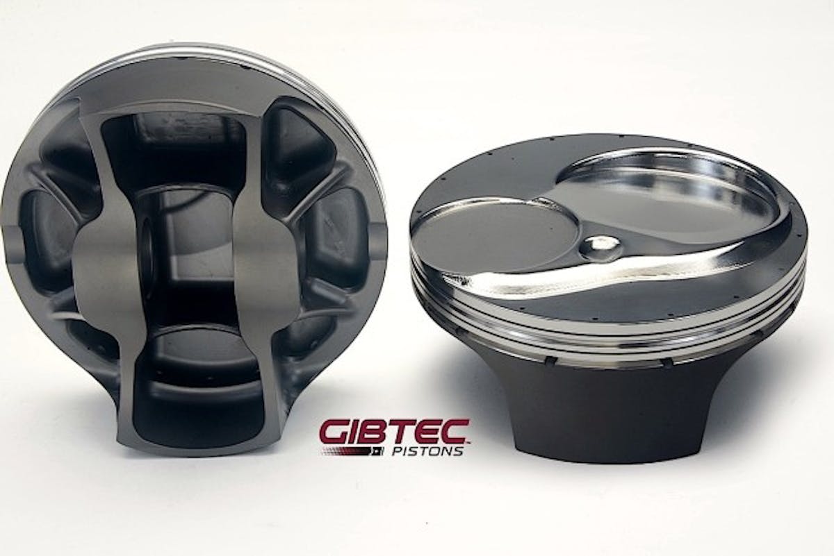 These GibTec Pro Stock pistons are three years old but offer a glimpse at the design factors needed for durability and low friction. Note the extensive support at the pin boss, narrow ring grooves and shallow skirts. Engine builders have options such as the number of gas ports and oil drain-back holes, depending on their needs.