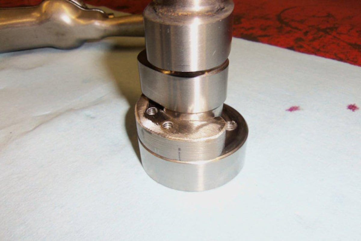 The specially-machined camshaft counterweight built by Terry
