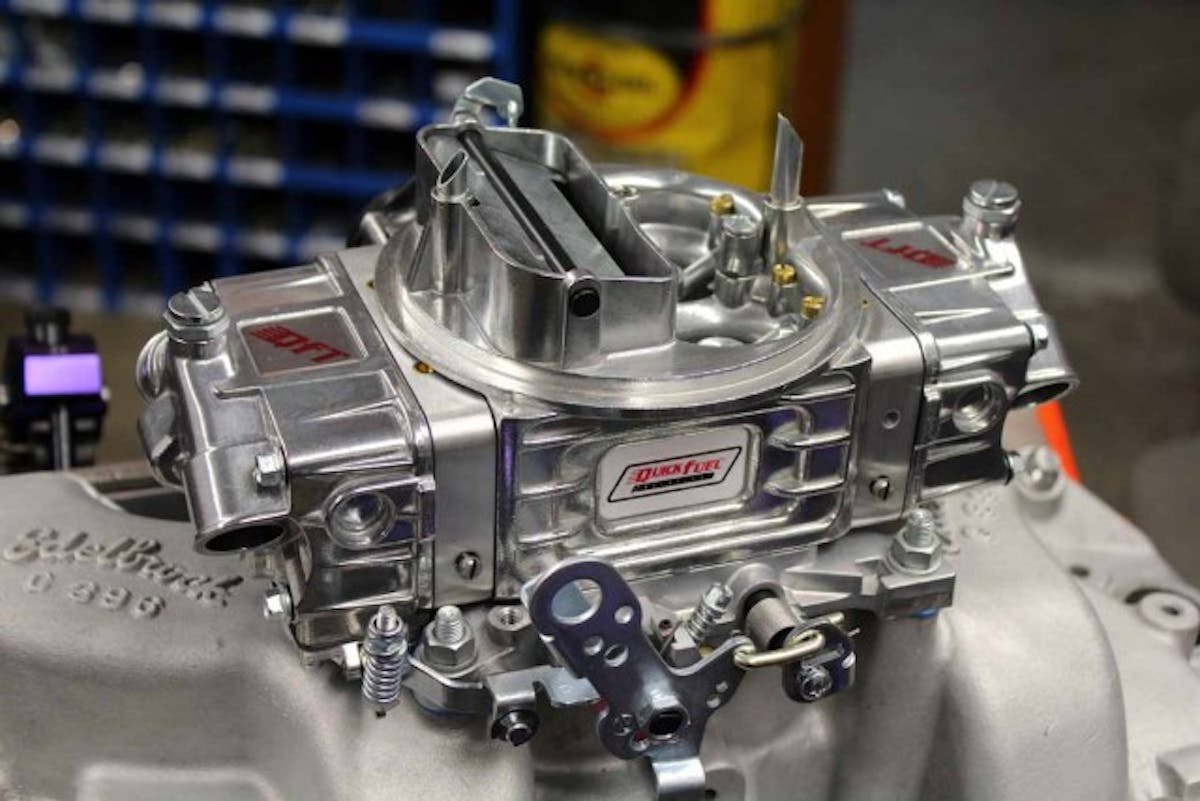 On top, an electric-choke Quick Fuel carburetor supplies the 93-octane pump fuel.