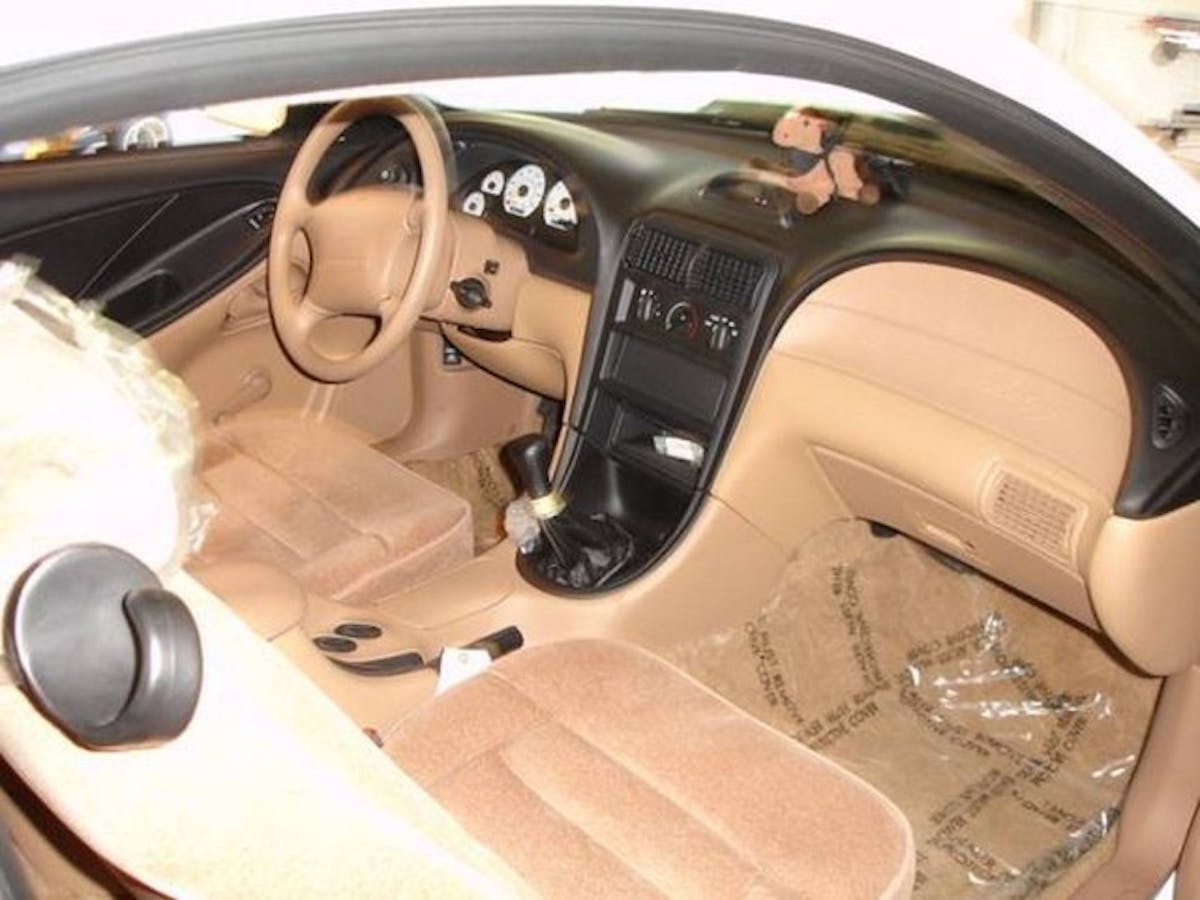 The Cobra R came with cloth seats, a rear seat delete, no A/C, no radio, roll-up windows, along with other weight saving features designed to cut down on the pounds.