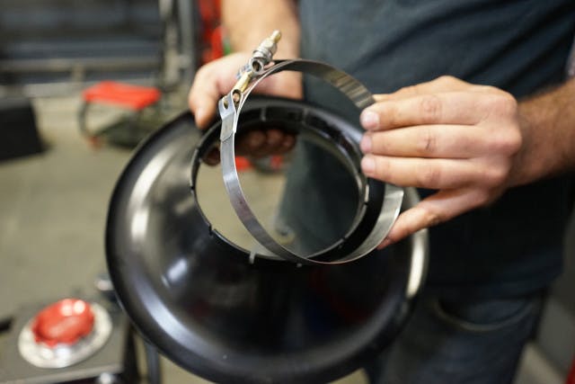 ProCharger 's bellmouth use a simple T-bolt clamp to mount on the supercharger head unit. The company's engineers went for a tight fit to keep the inlet from rattling loose. According to Shifman, some heat is actually necessary to expand the inlet just enough to fit it over the blower for installation.