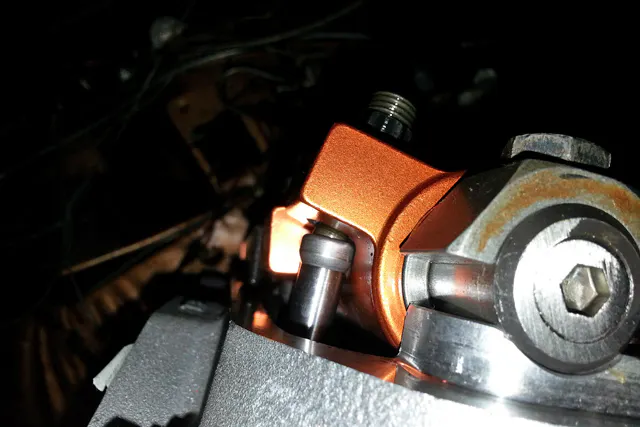 Checking rocker tip adjustment of the Harland Sharp roller rockers.