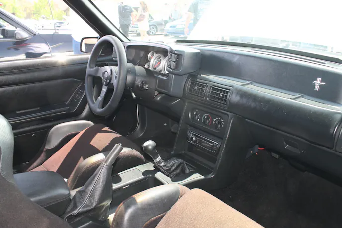 The car originally came with a red interior, but Aliaga found a complete black interior on Craigslist, and converted it over, using Subisport Cobra seats, a Maximum Motorsports 6-point bar, an MC Machine cluster with Auto Meter gauges, and a tilt column with a Momo steering wheel.