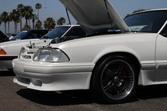 Being a '90 model, the LX had black moldings, but Aliaga had the car repainted in a Lexus Pearl white, with TrueForged Victory wheels bolted to Cobra brakes.