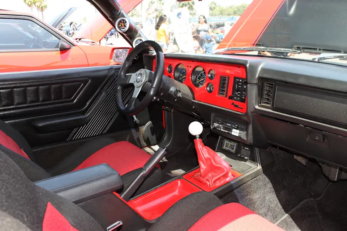 The GT's interior is largely stock, save for a few MGW accessory knobs, a Momo steering wheel, and reupholstered seats.