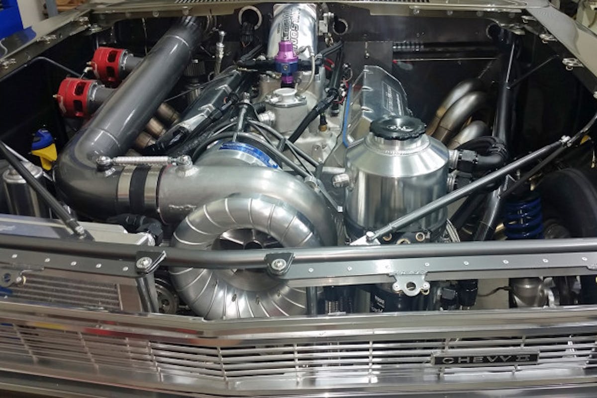 Another angle of the killer bullet between the framerails of this slick Chevy II.