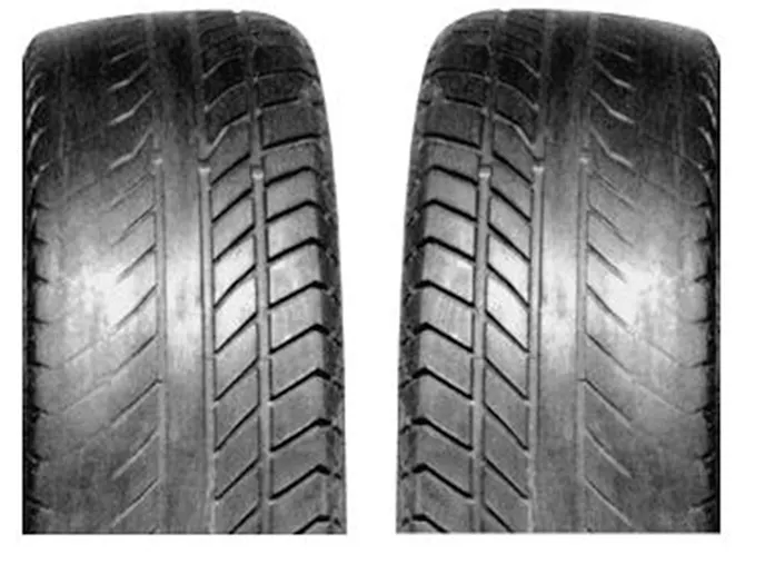 This tire shows evidence of wear caused by problems with both toe and camber. The irregular wear pattern, called feathering, is caused by a toe out condition. Image by author.