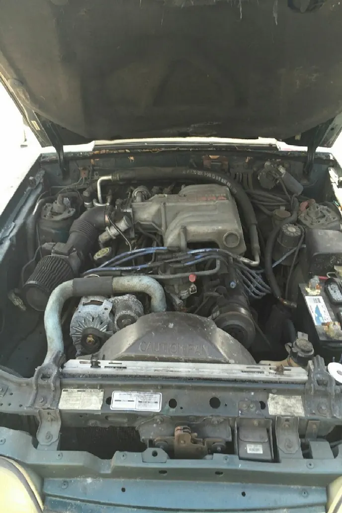The GT's engine is intact, and runs. The stock airbox, as you can see from the interior image, was discarded in favor of a short conical filter. The engine does have silicone hoses, an aluminum radiator, a Cobra intake, and headers. With 4.10 gears out back, the car would definitely have spirited acceleration if running right. Smith's goal is to get it running right, and then figure out his next move with the car.