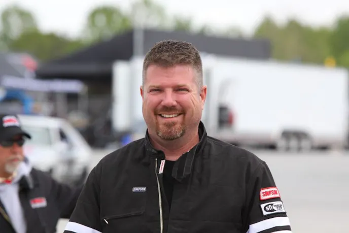 Hi-Po Joe Charles eyes a Racepak Sportsman IQ3 dash, an Auto Meter Playback tach, and G-Force 5-point harnesses on each pass in Coyote Stock, but it's time for someone to give them the look-see in NMRA Coyote Stock competition.