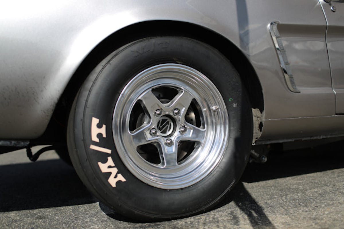 The new 3052R tire on our Project Biting The Bullitt 1965 Mustang. The radials are wrapped around JEGS Sport Star II 15x8-inch wheels, which are made from a cast A-356 alloy and CNC-machined with a polished finish.