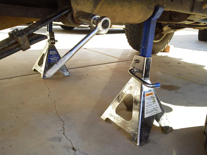 An excellent shot showing proper placement of the jack stands just in front of the front mounting bracket on the frame rail. Image by author.