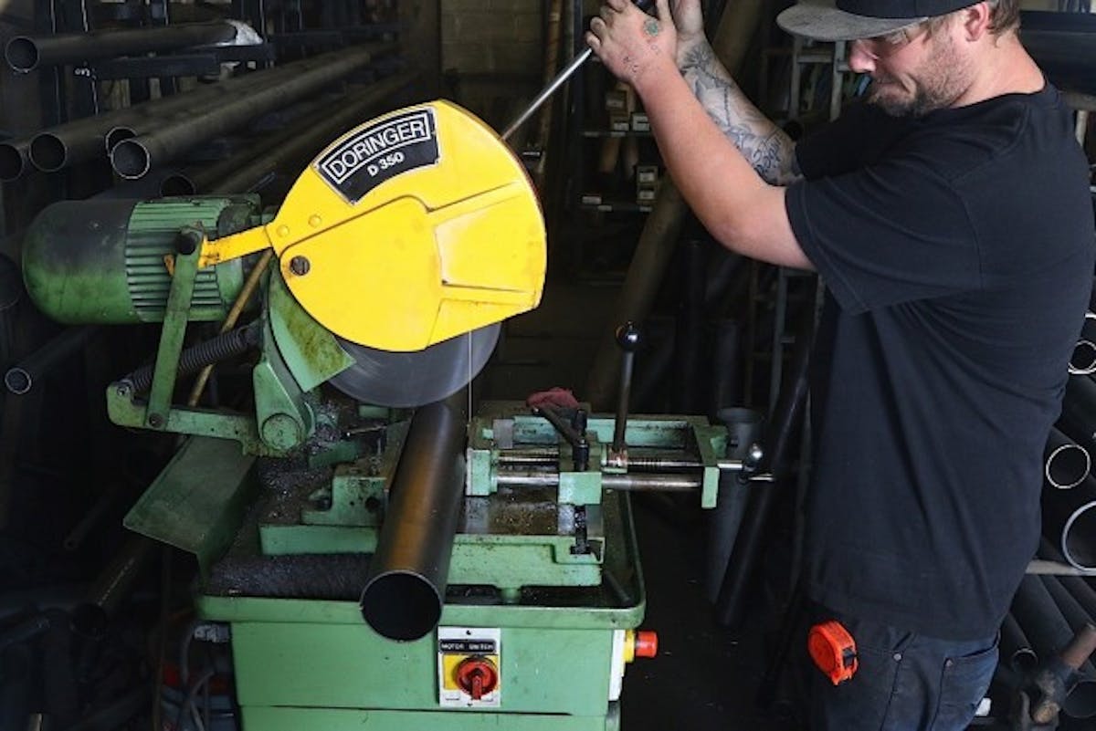 The appropriate tubing is cut to length.