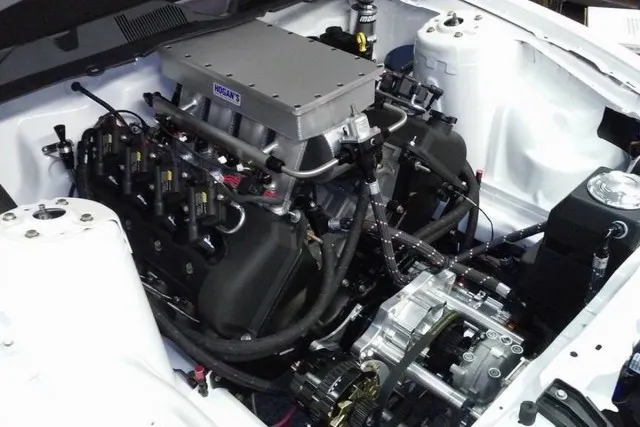 The engine uses a Hogan sheet metal intake to inhale air from a Vortech YSi supercharger. Behind the built Four-Valve is a M&M Transmission Turbo 400 with an Ultimate Converter Concepts stall converter.