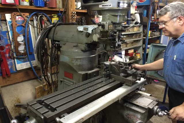 Fred Blue of Blue Performance machining a custom piston to fit the combustion chamber perfectly.  
